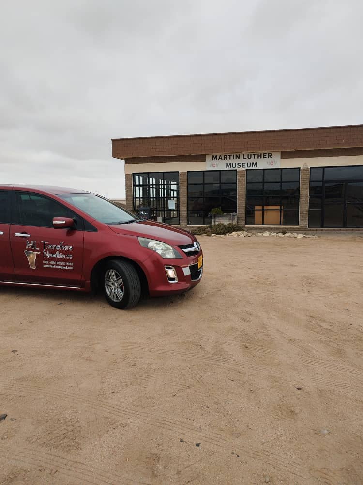 M·L Transfer van outside the Martin Luther Museum in Swakopmund